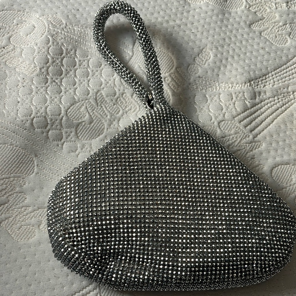 Cute purse, silver shiny beads, zips and snaps closed. Very cute!